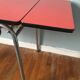 Large table in red formica with extensions + red drawer