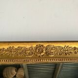 Golden mirror style Restoration decorated with stretched palmettes