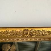 Miroir doré style Restauration à décor de palmettes étirées