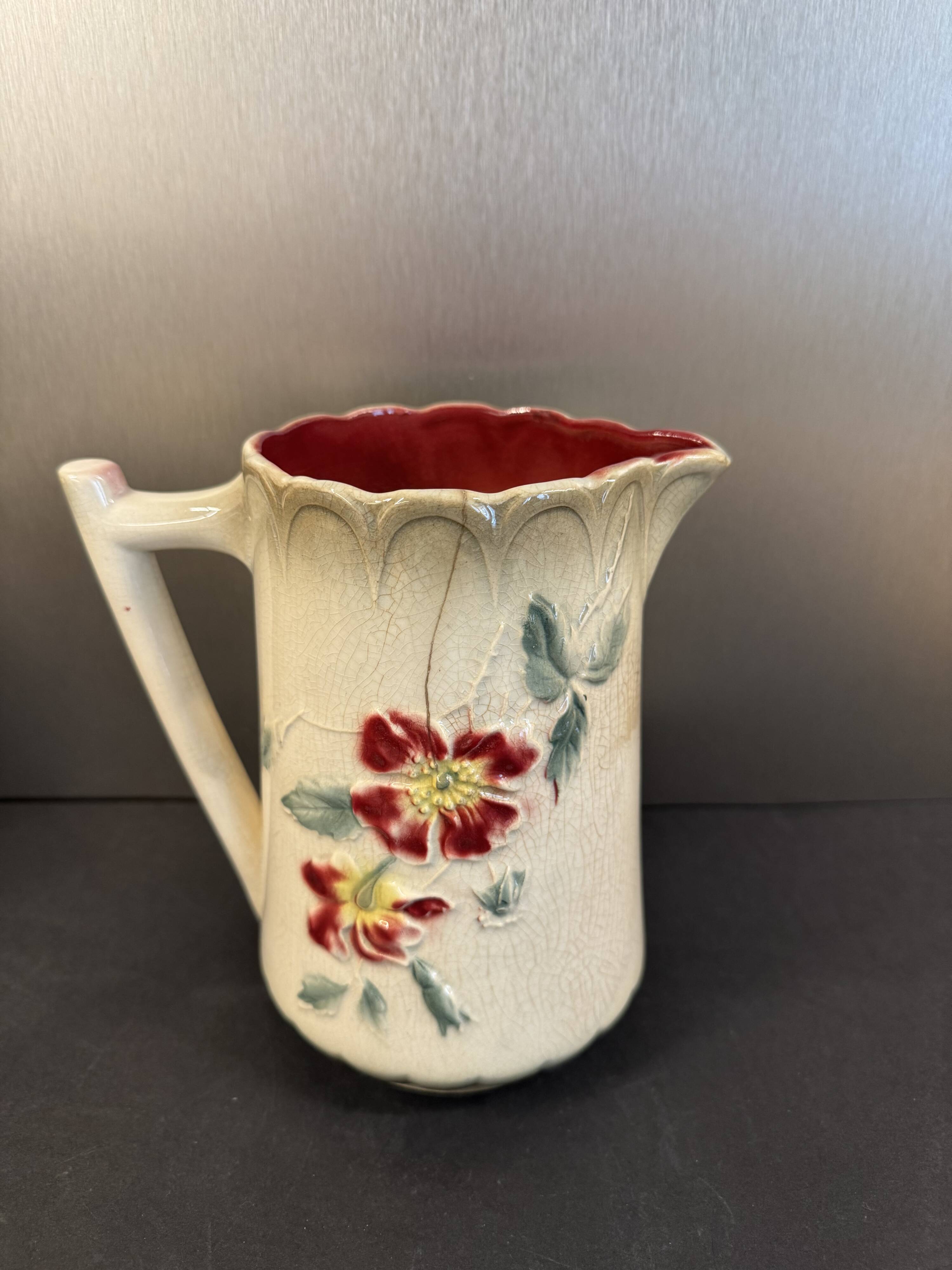 Antique pitcher in slipware with floral decoration – red and cream floral design