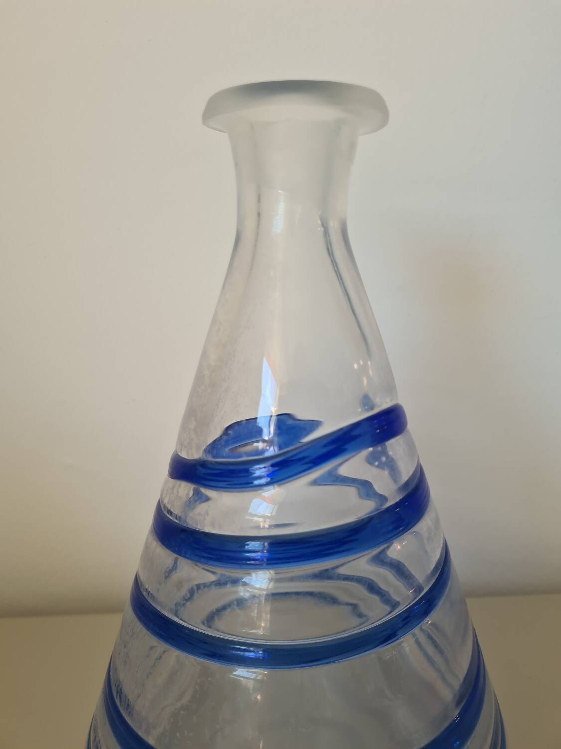 Conical glass vase/carafe blown with a blue spiral decoration.