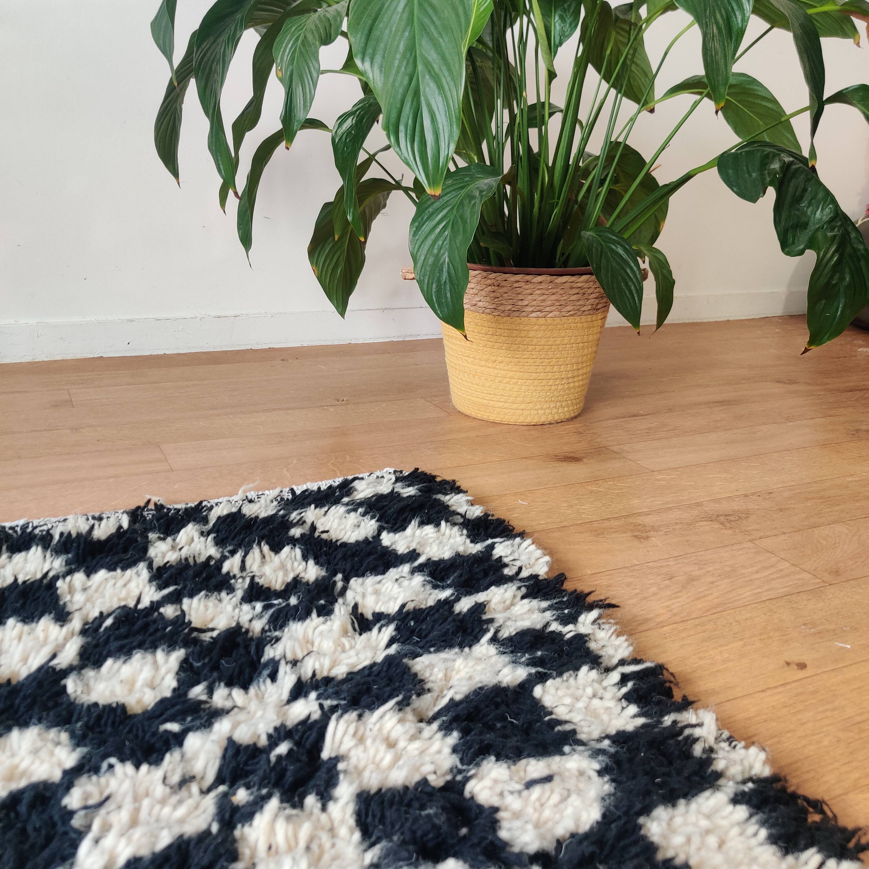 Small black tile Berber rug