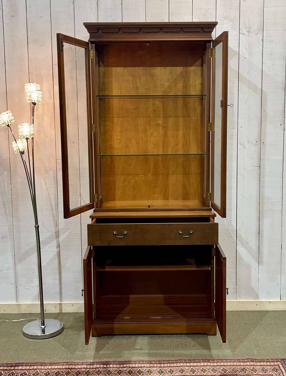 English display cabinet with two sections made of yew from the 1980s.