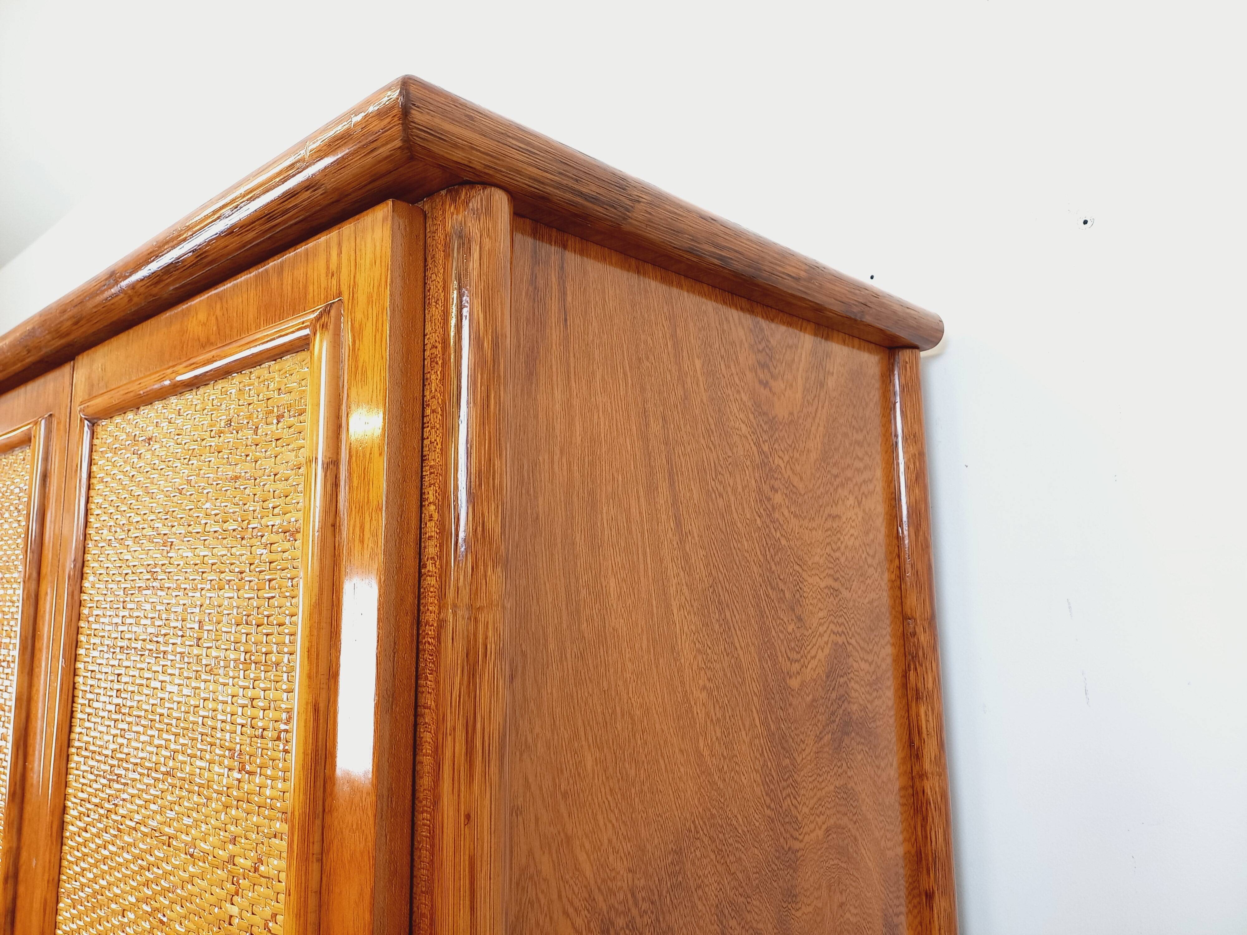 Vintage woven rattan and wood armoire by Maugrion for Roche-Bobois.