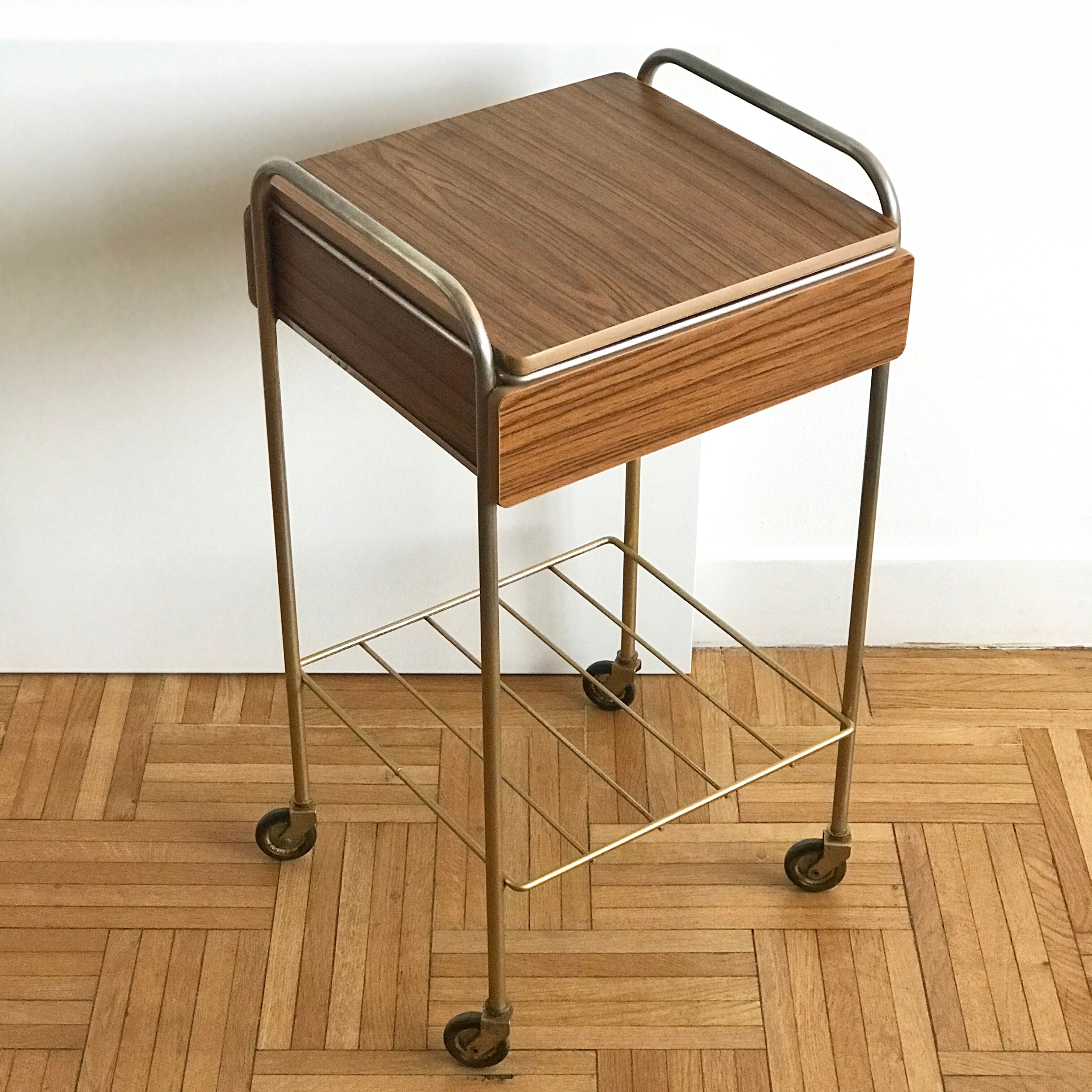 Serving bedside in gold metal and formica