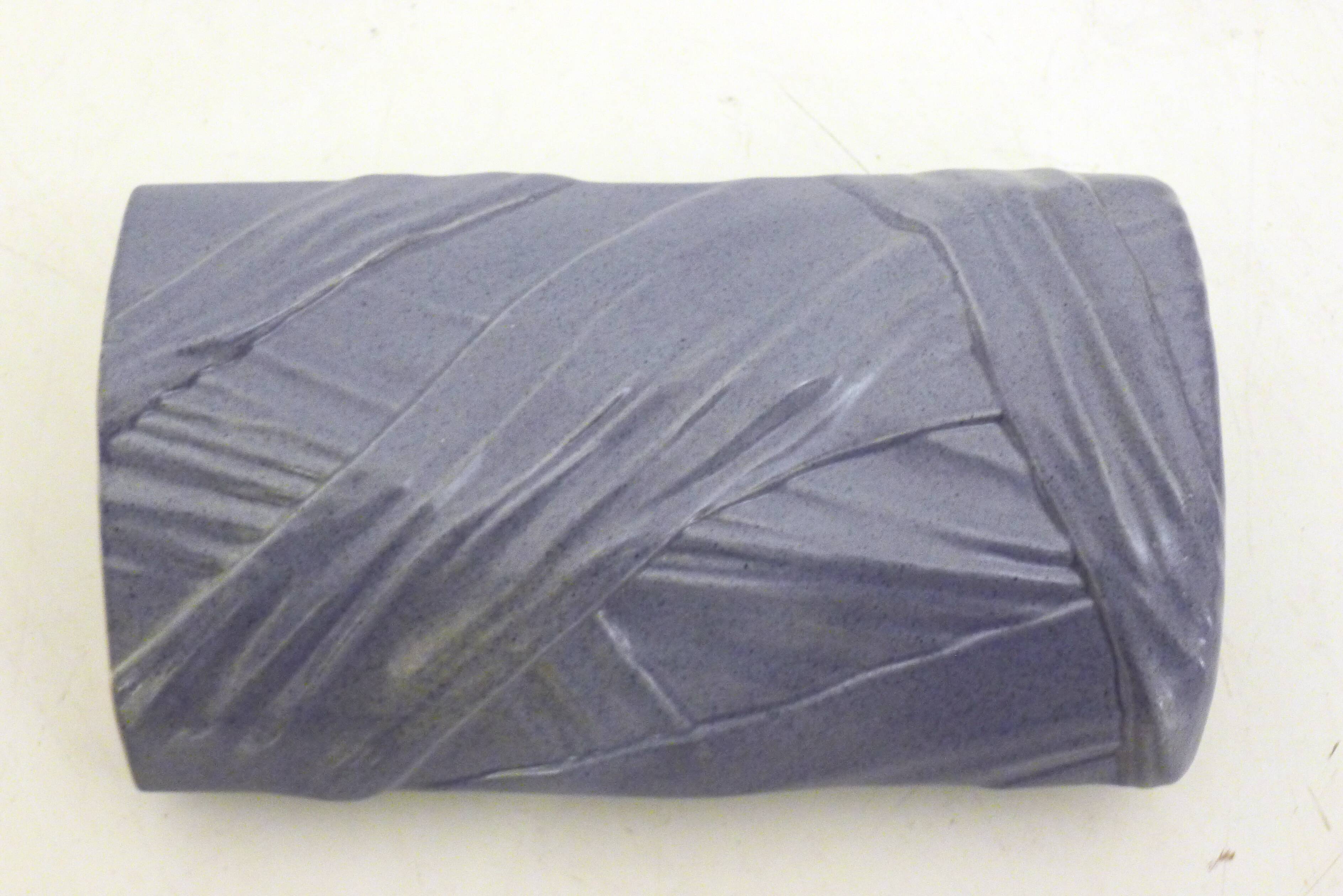 Purple vase, draped ribbons in relief