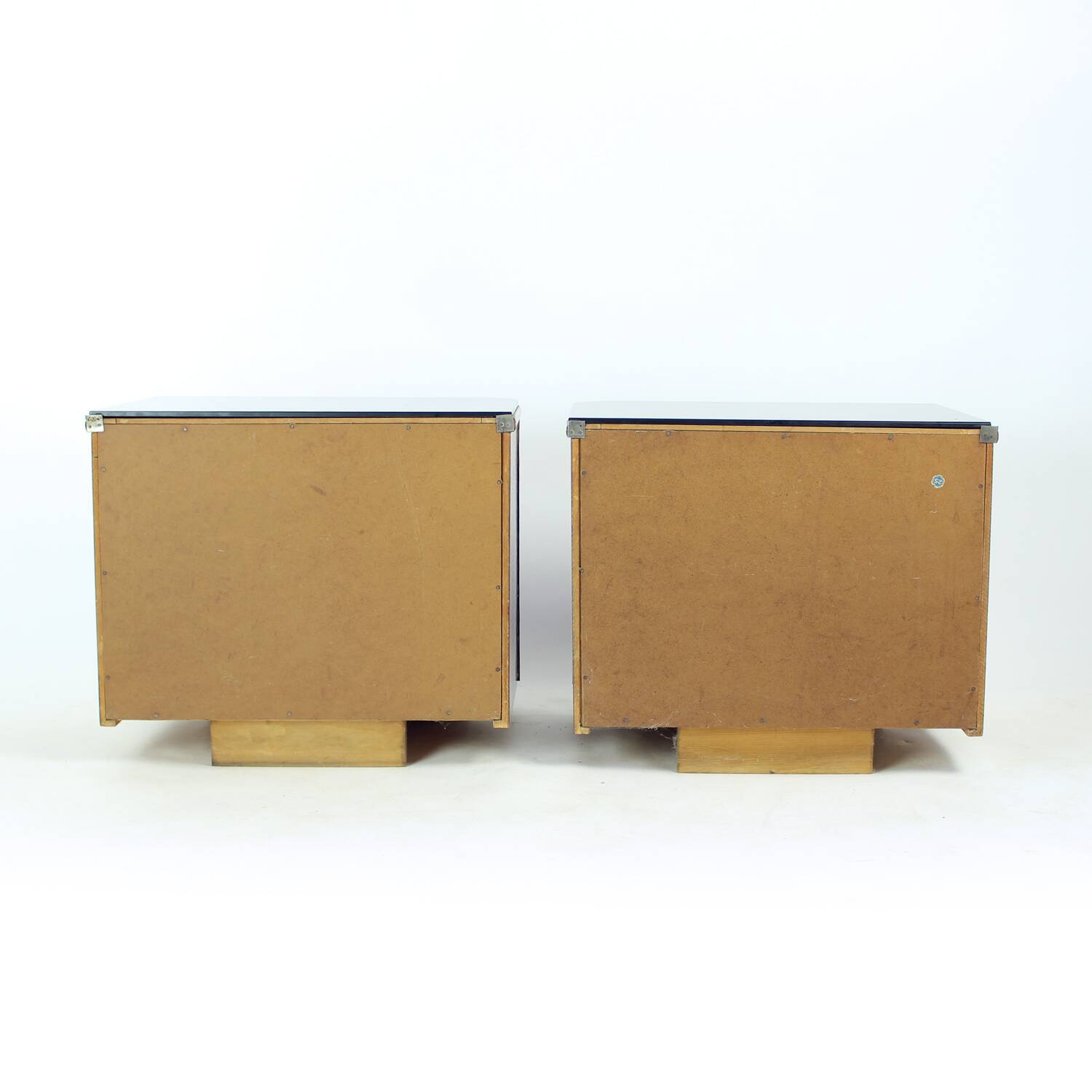 Pair of Art Deco bedside tables in walnut and black glass, Czechoslovakia.