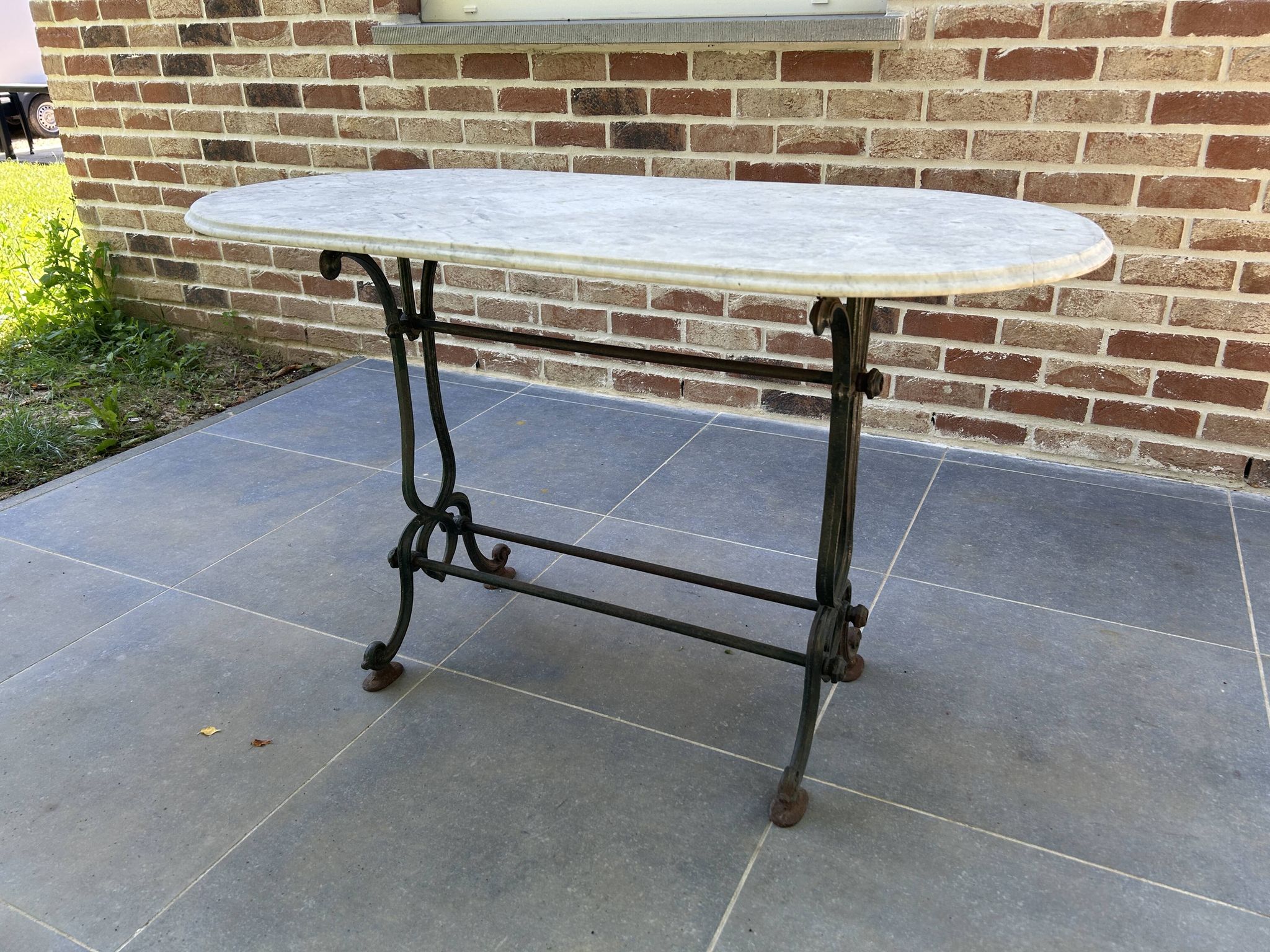 Art Nouveau cast iron and marble bistro table.