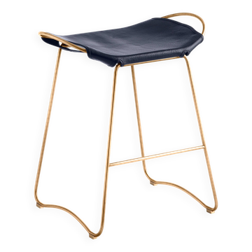 Contemporary organic bar stool, aged brass metal and navy blue leather.