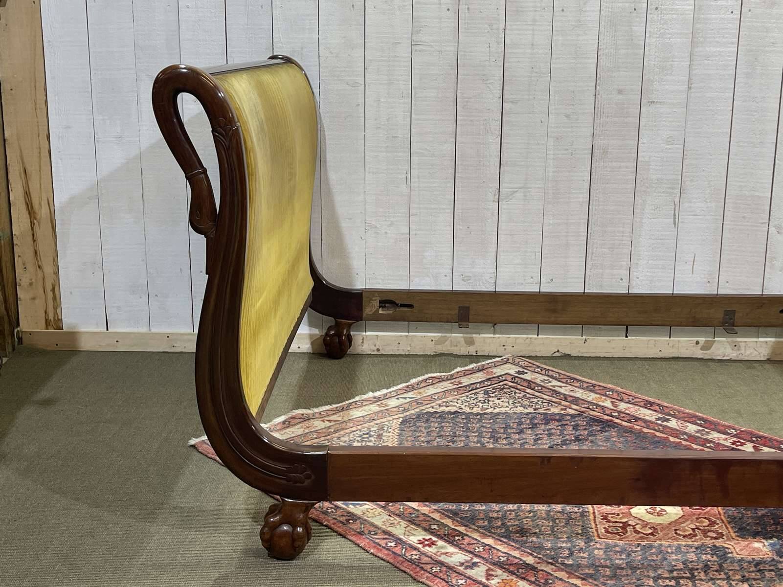 Early 19th century Empire mahogany bed with swan neck finials and claw feet