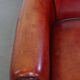 Armchair made of sheepskin leather in a red/brown color