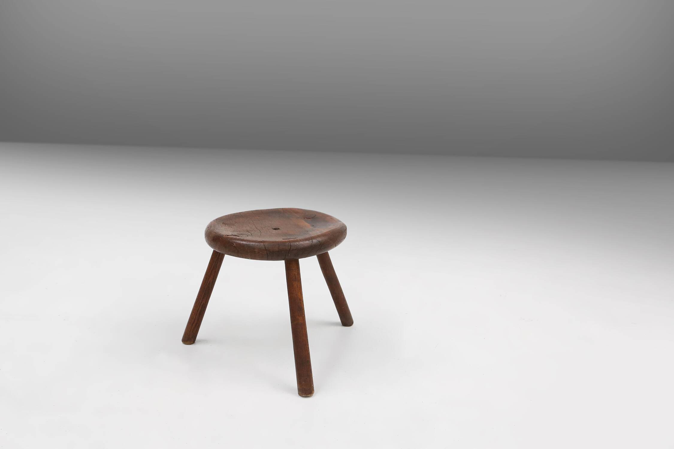 Hand-carved solid wood tripod stool with beautiful patina, France ca. 1900