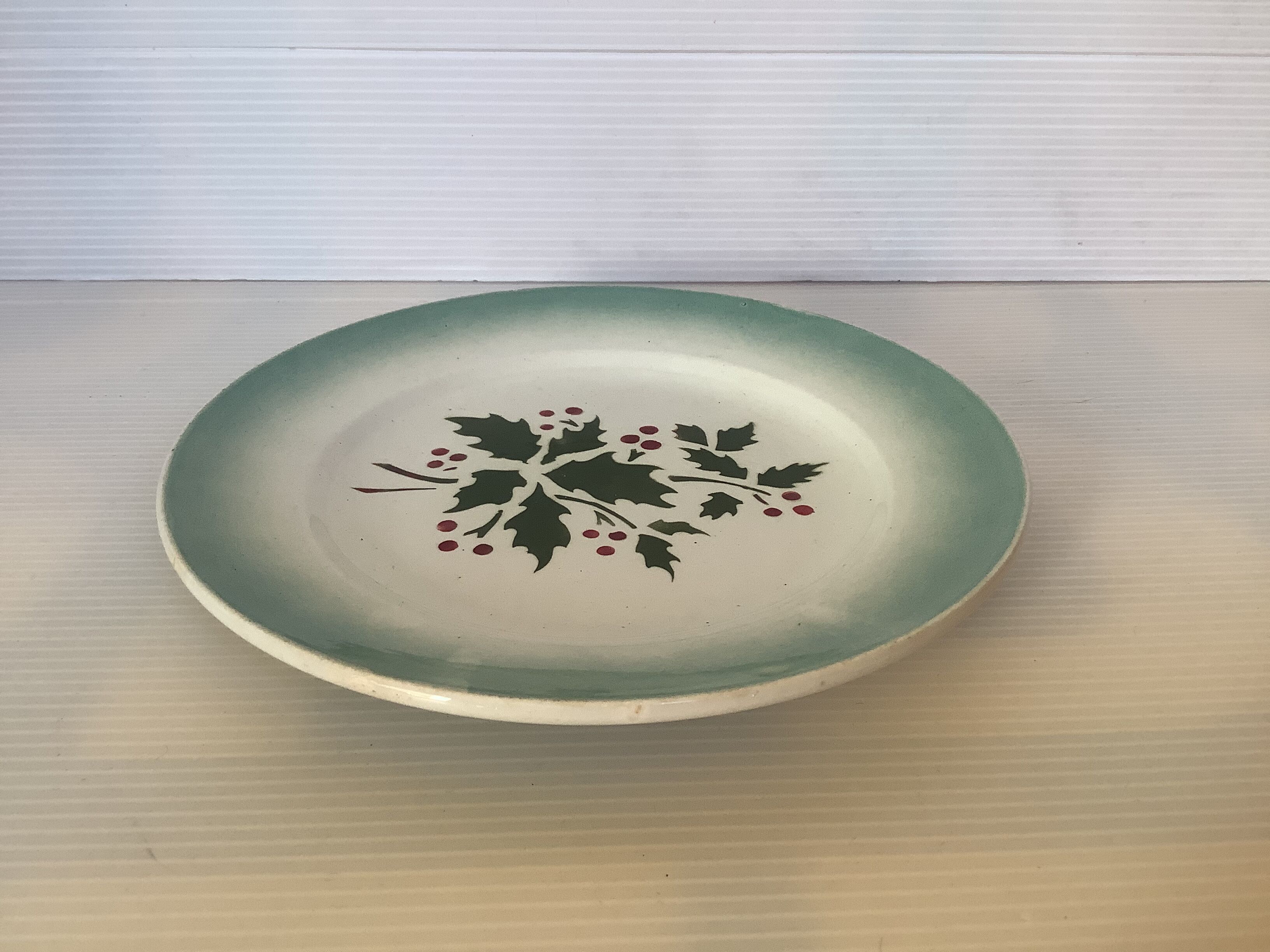 Old earthenware plate holly pattern