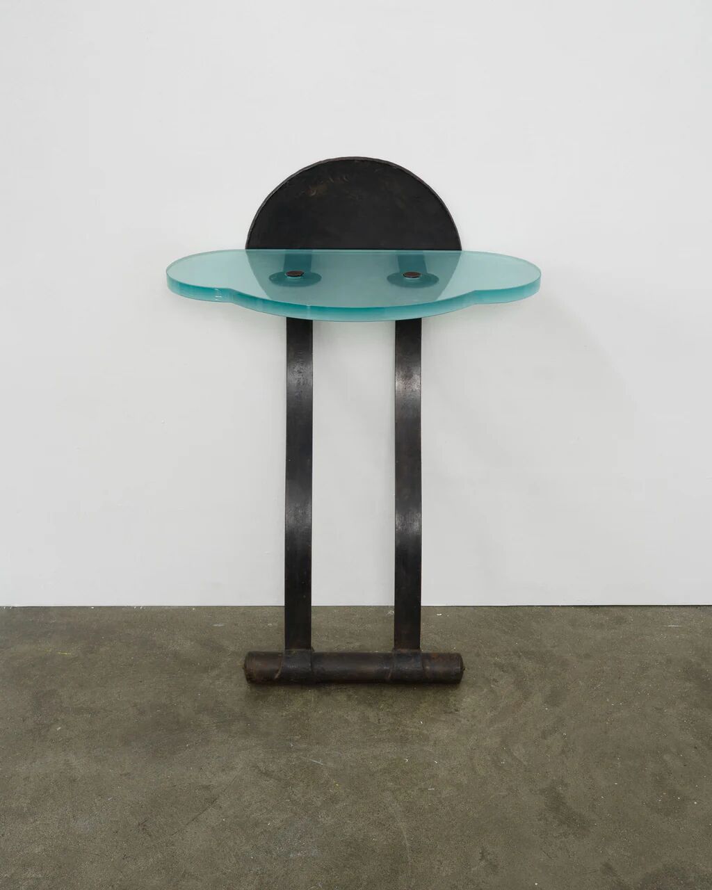 Artisanal wrought iron and cast glass leaning console table