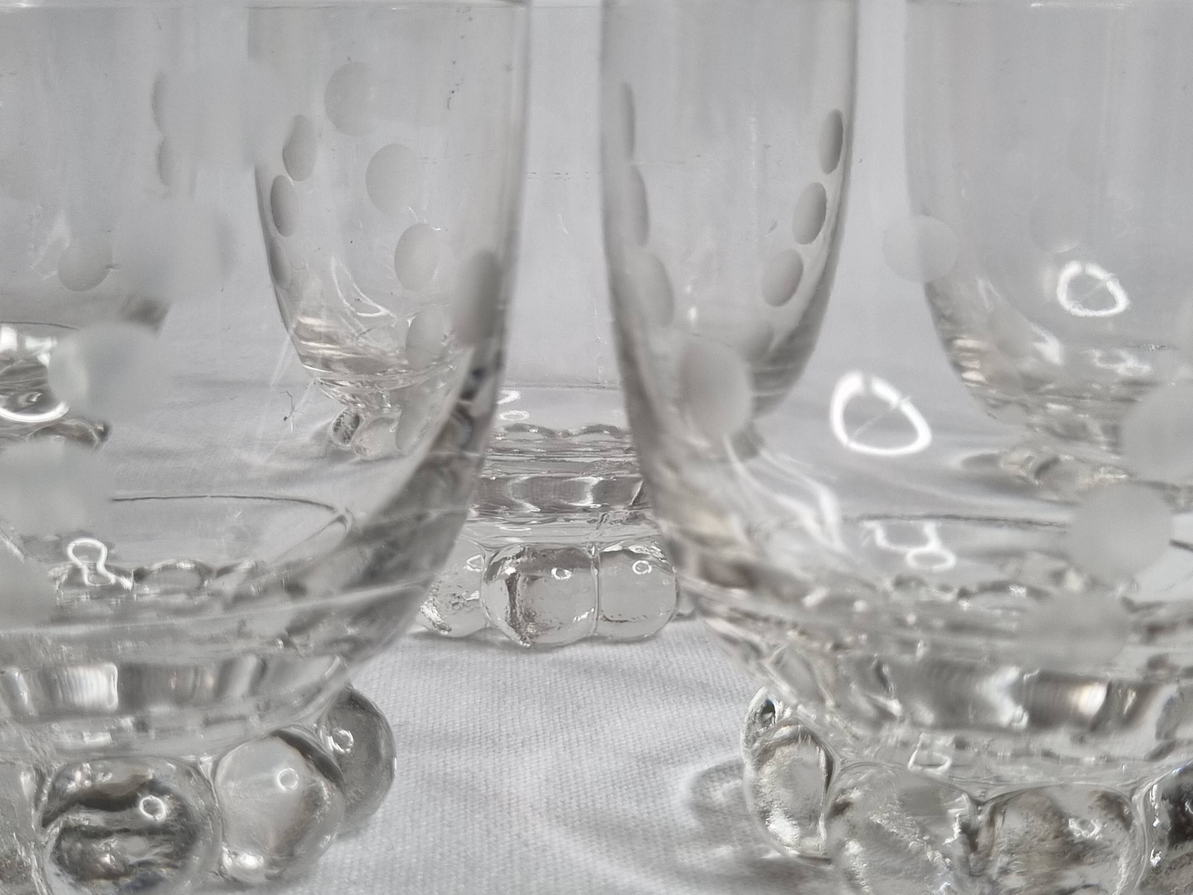 Set of six Art Deco style engraved crystal glasses on spherical feet