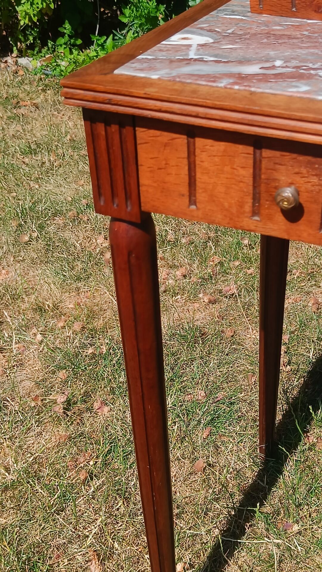 Art Deco oak dressing table, marble top and swivel mirror.
