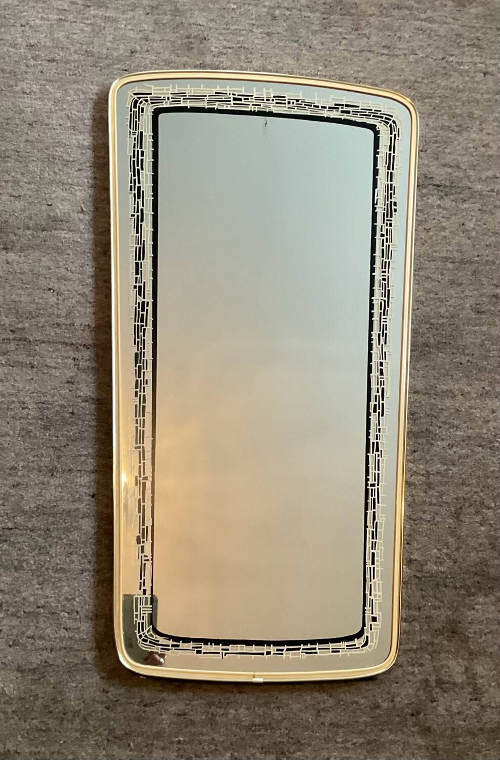 Asymmetrical free-form mirror from the 1970s