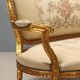 Neoclassical canapé in gilded wood