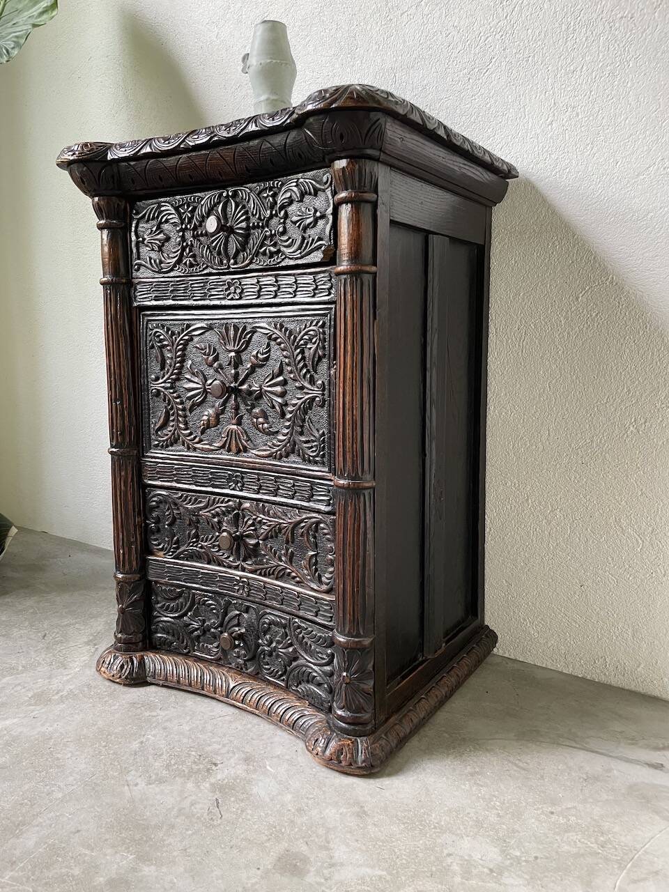 19th century chest of drawers in carved blackened pine