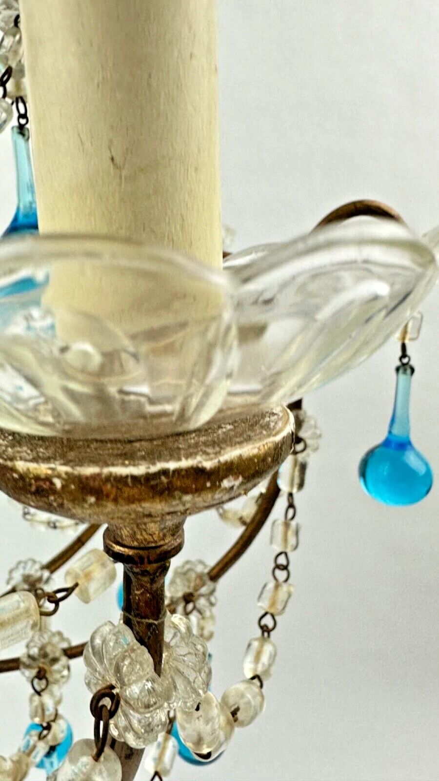 Italian chandelier with blue beads and gilded wood.