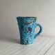 Blue glazed ceramic pitcher