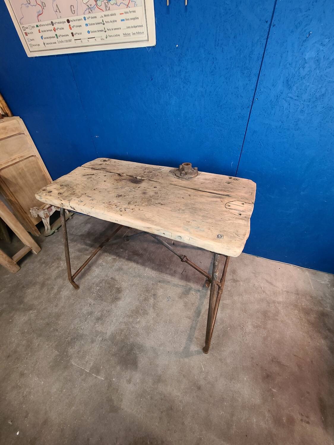 Vintage workbench circa 1930, folding metal leg.