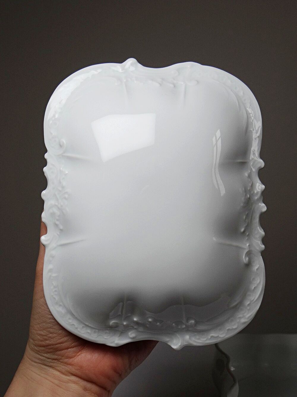 Vintage Limoges porcelain bonbonnière in white with rococo decoration.