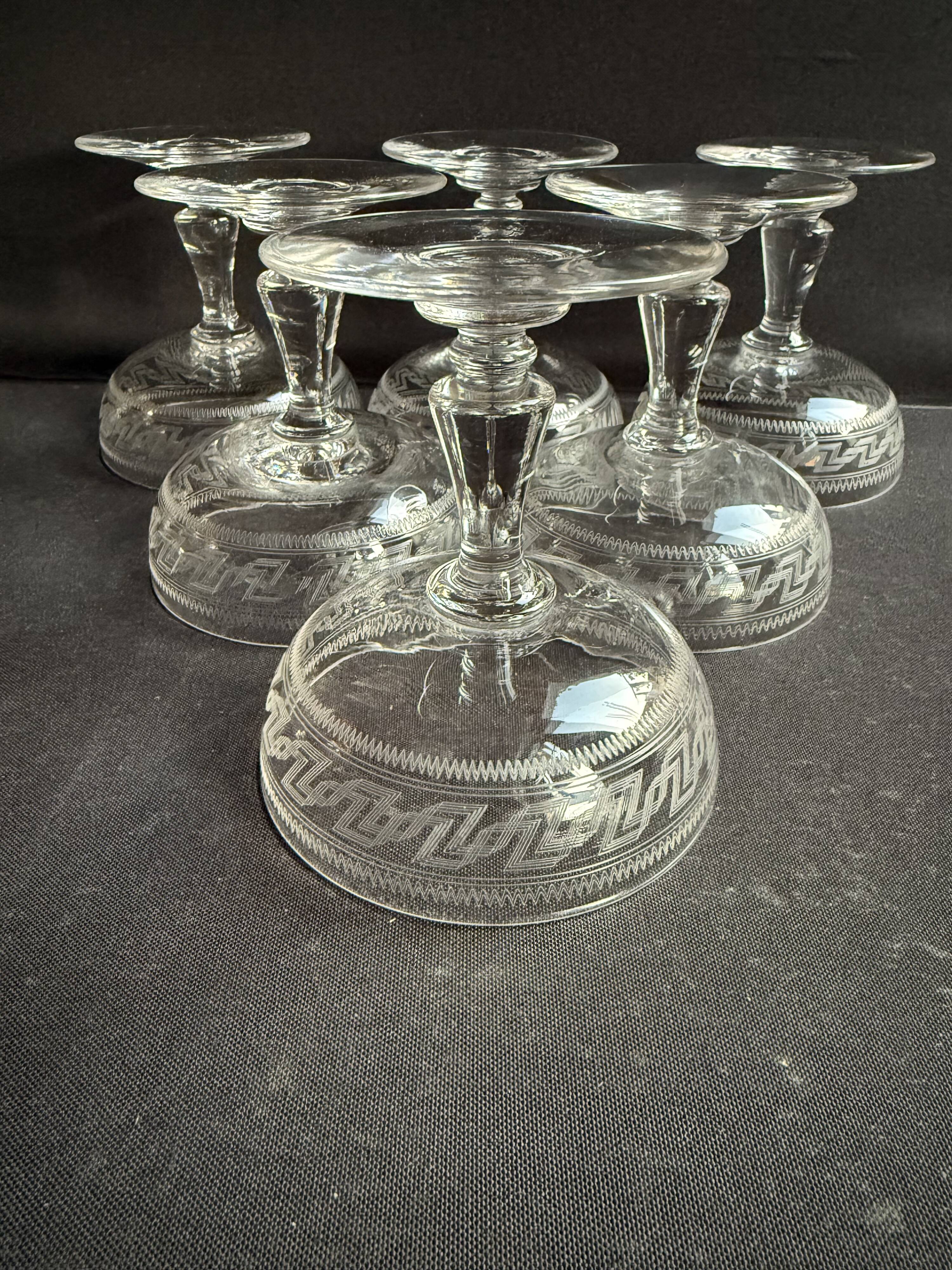 6 Baccarat champagne coupes with Greek engraving, slanted.