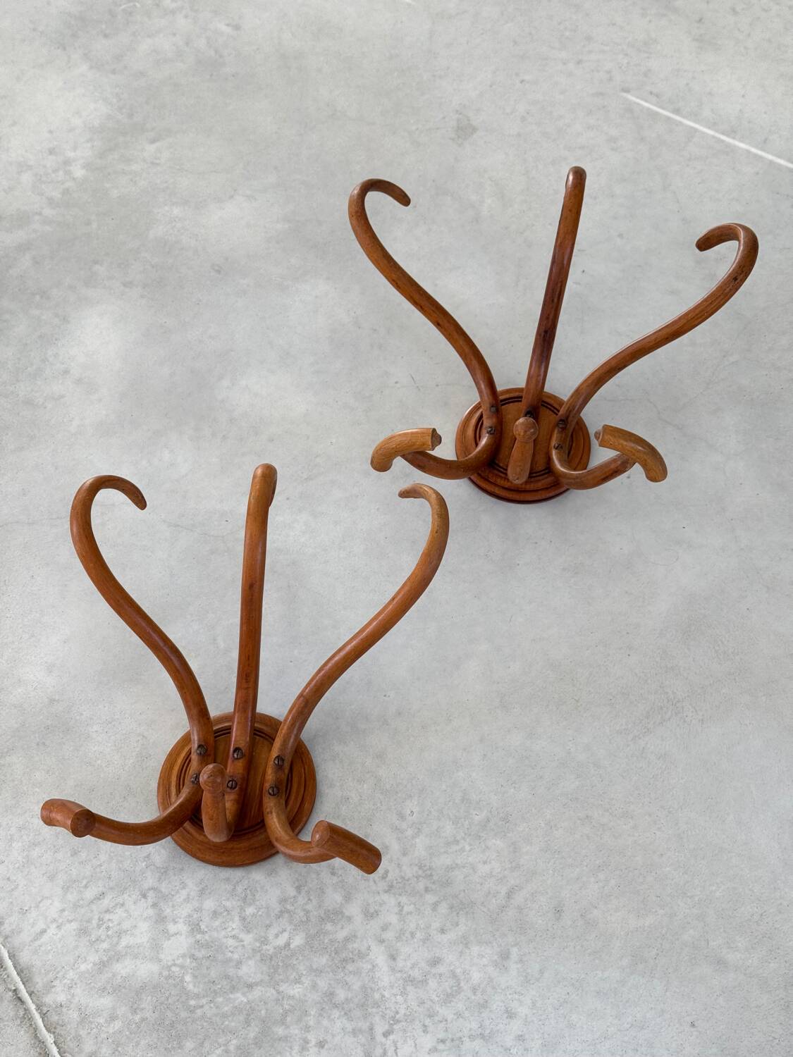 Pair of curved wooden coat racks or hooks from the 1900s