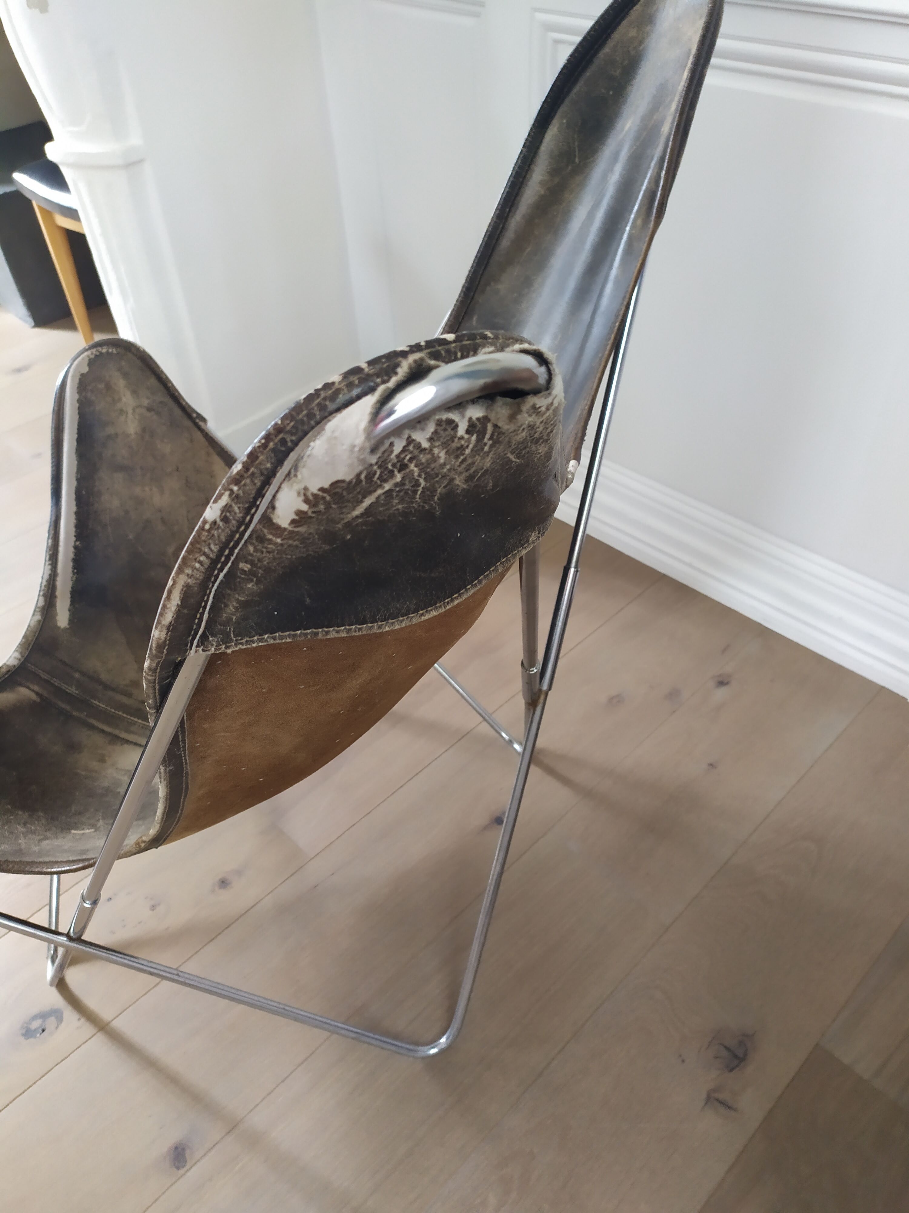 AA Butterfly leather armchairs