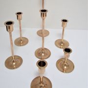 Series of seven candle holders solid brass
