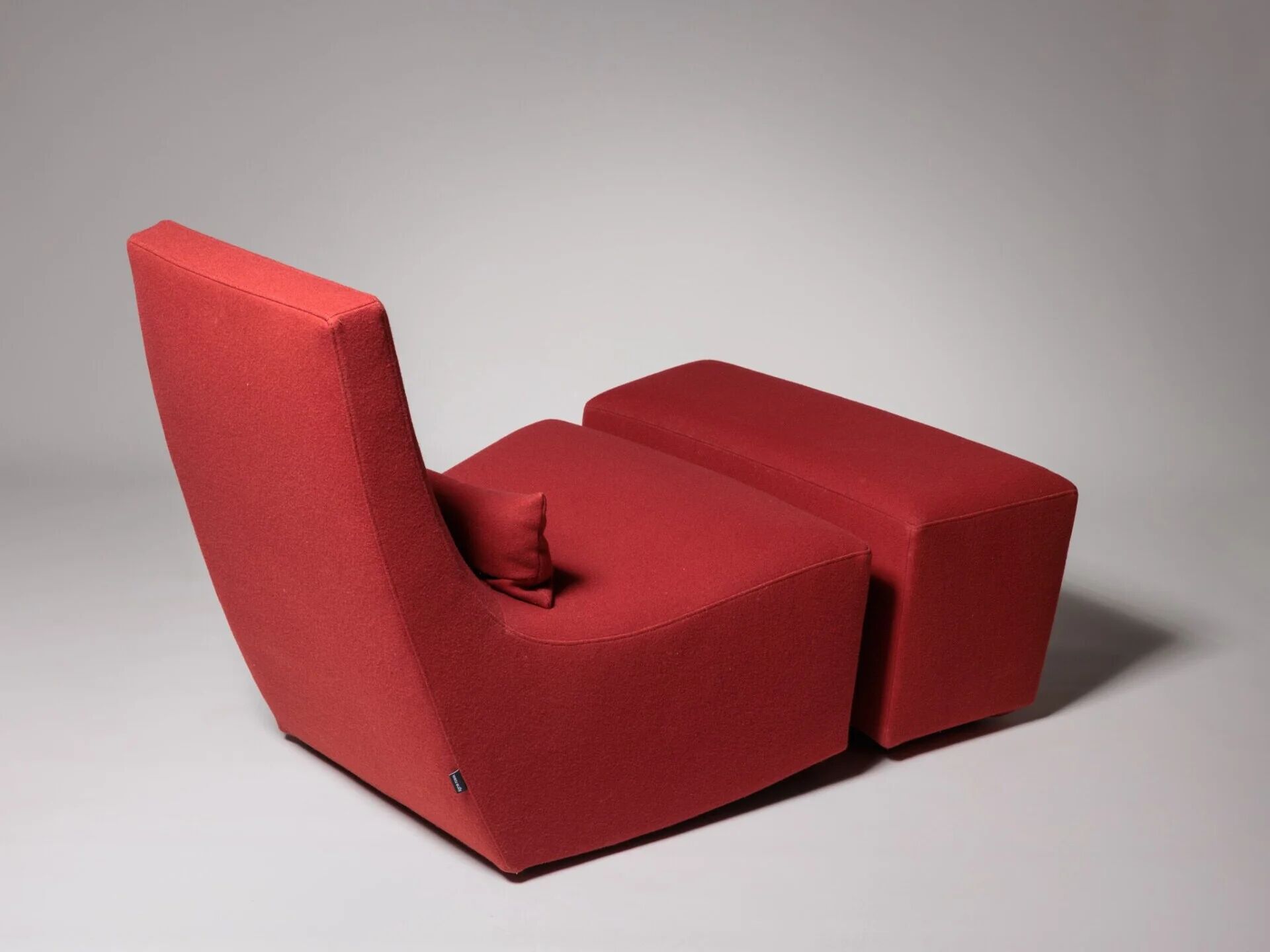 Rocking chair and footstool in red wool by Ligne Roset, France
