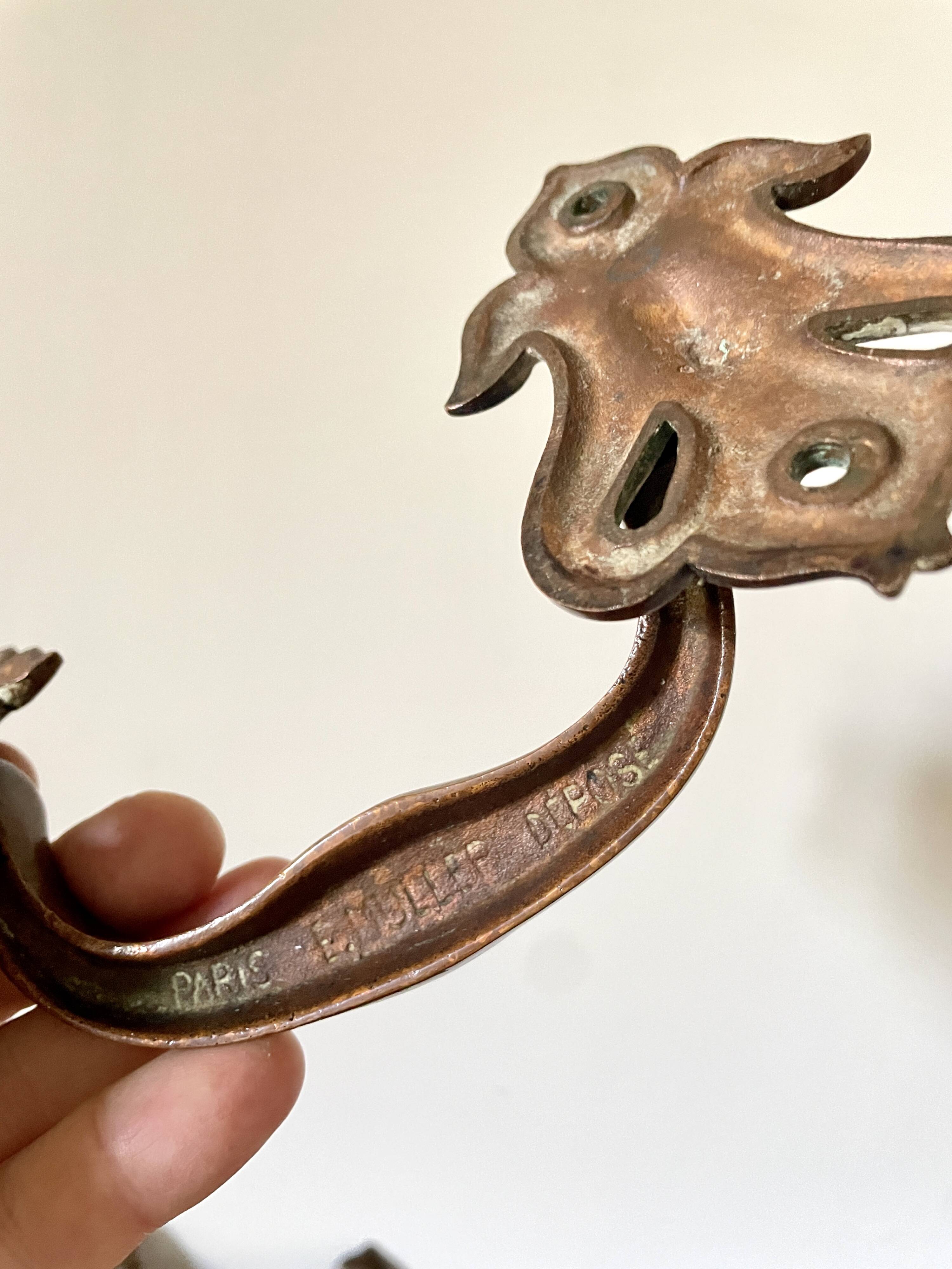 Pair of bronze handles by Emile Muller, 19th century.