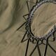 Old wrought metal sun mirror