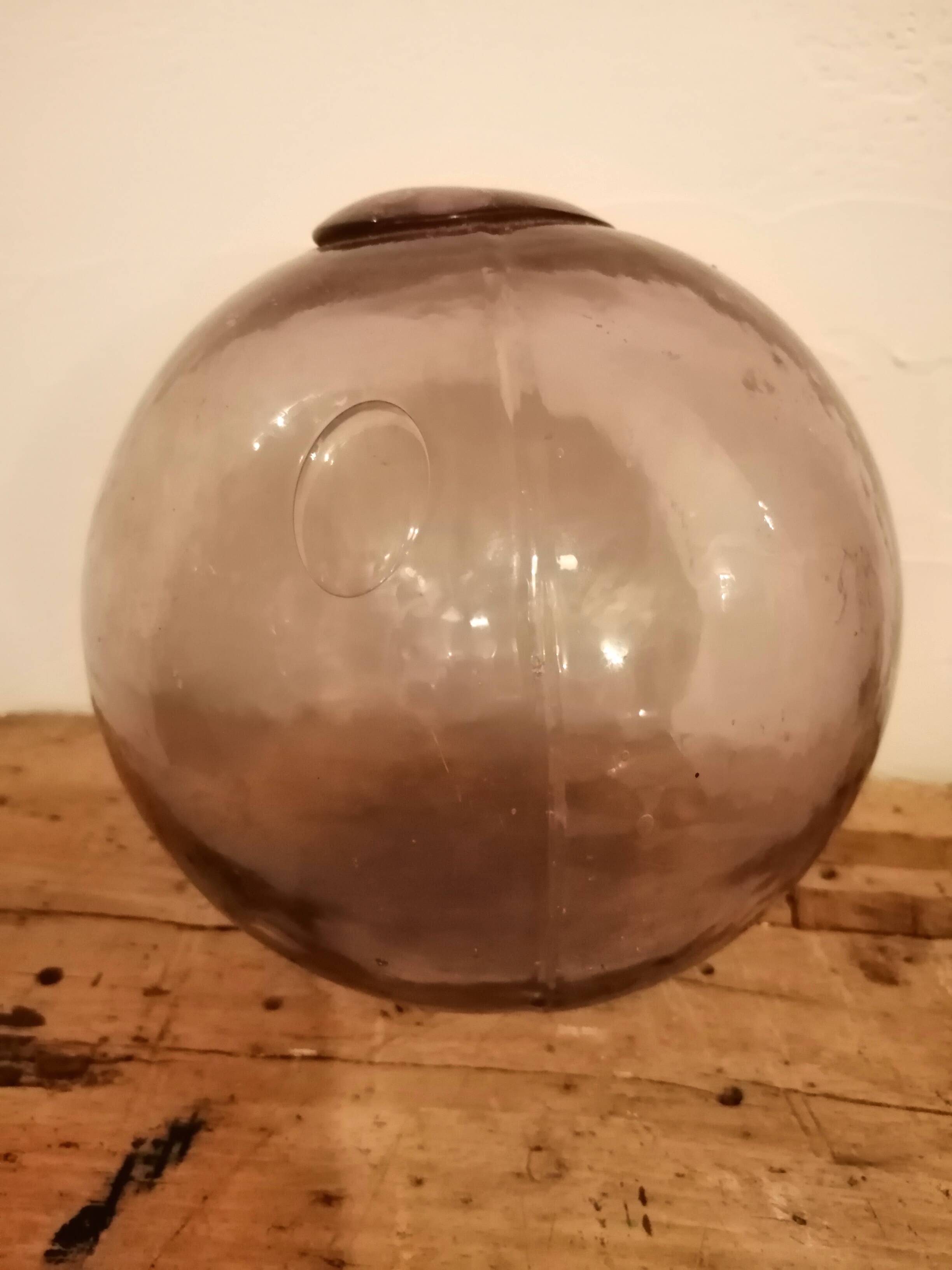 Old glass ball of fishing net marked "LT"