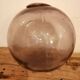 Old glass ball of fishing net marked "LT"