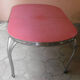Vintage table of the 60s in red formica and chrome legs