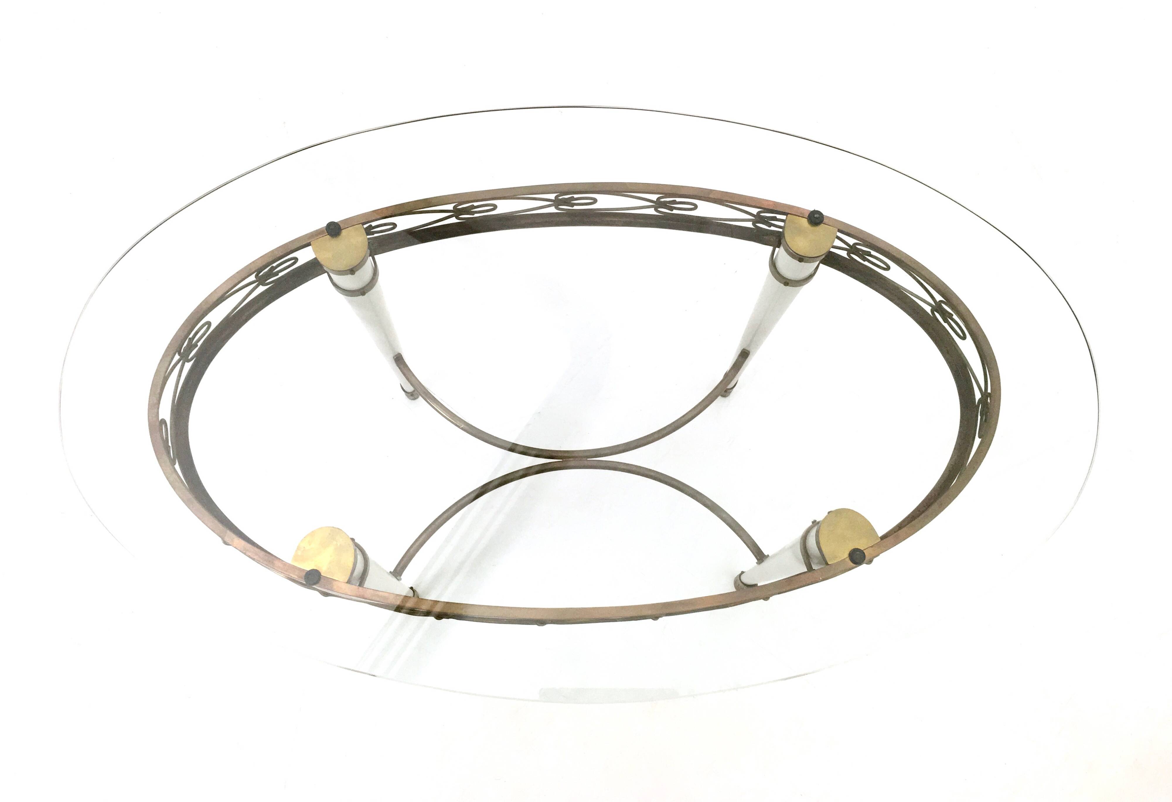 Brass Coffee Table with an Oval Glass Top in the Style of Pierluigi Colli
