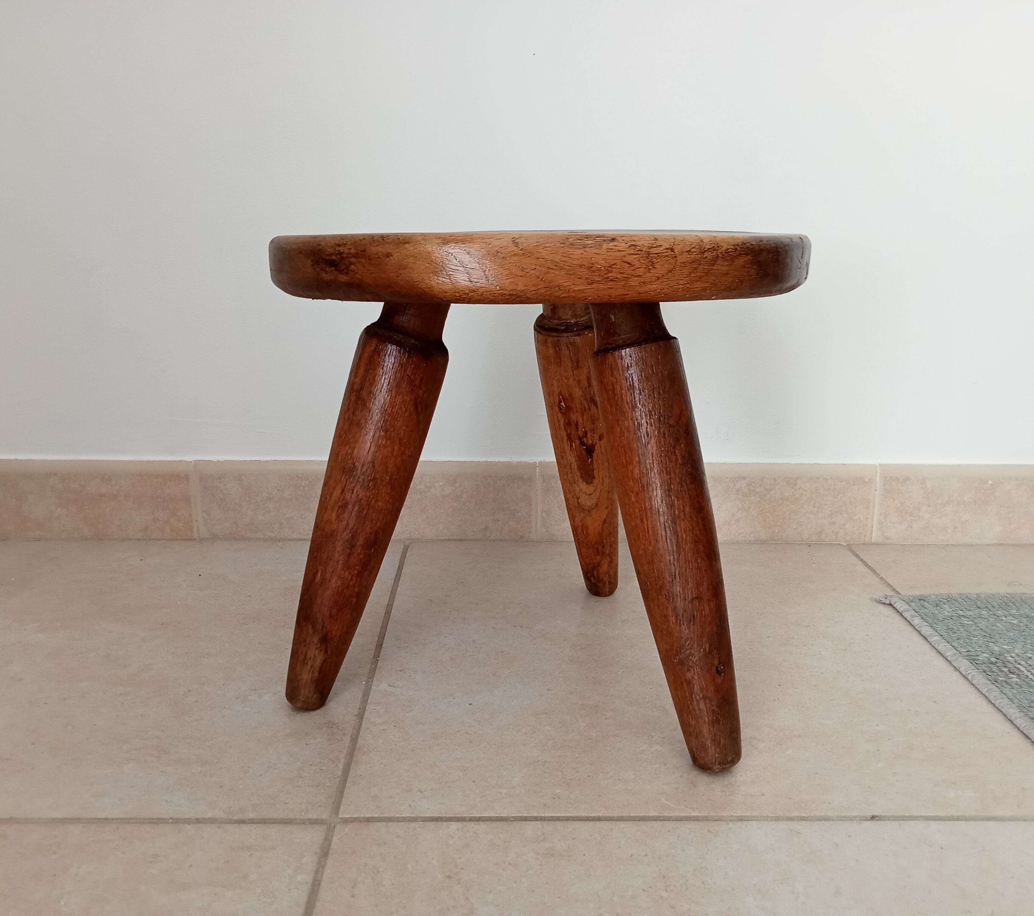 Antique walnut milking stool