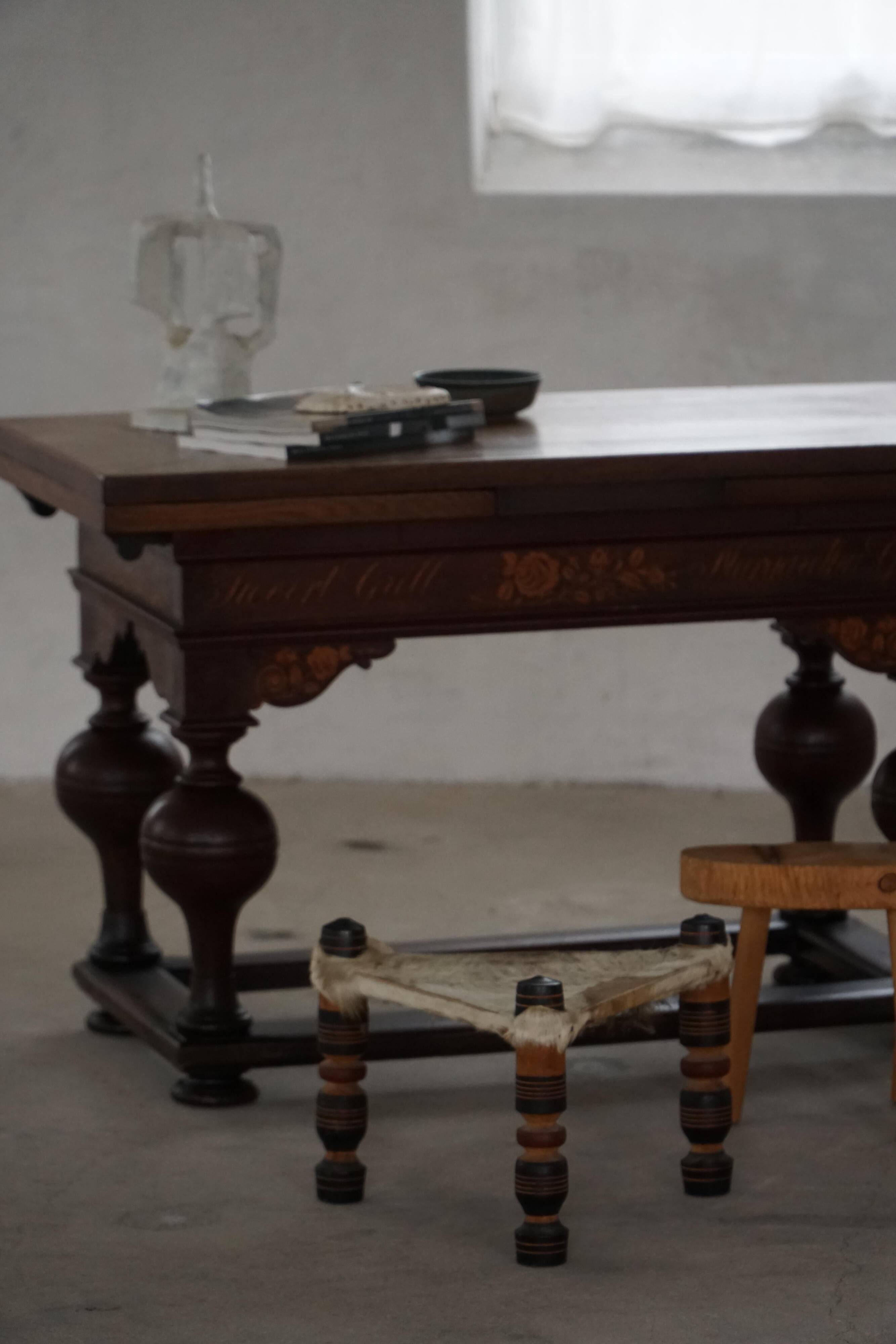 Vintage African artisanal stool, triangular shape with 3 legs, cowhide, 20th century.