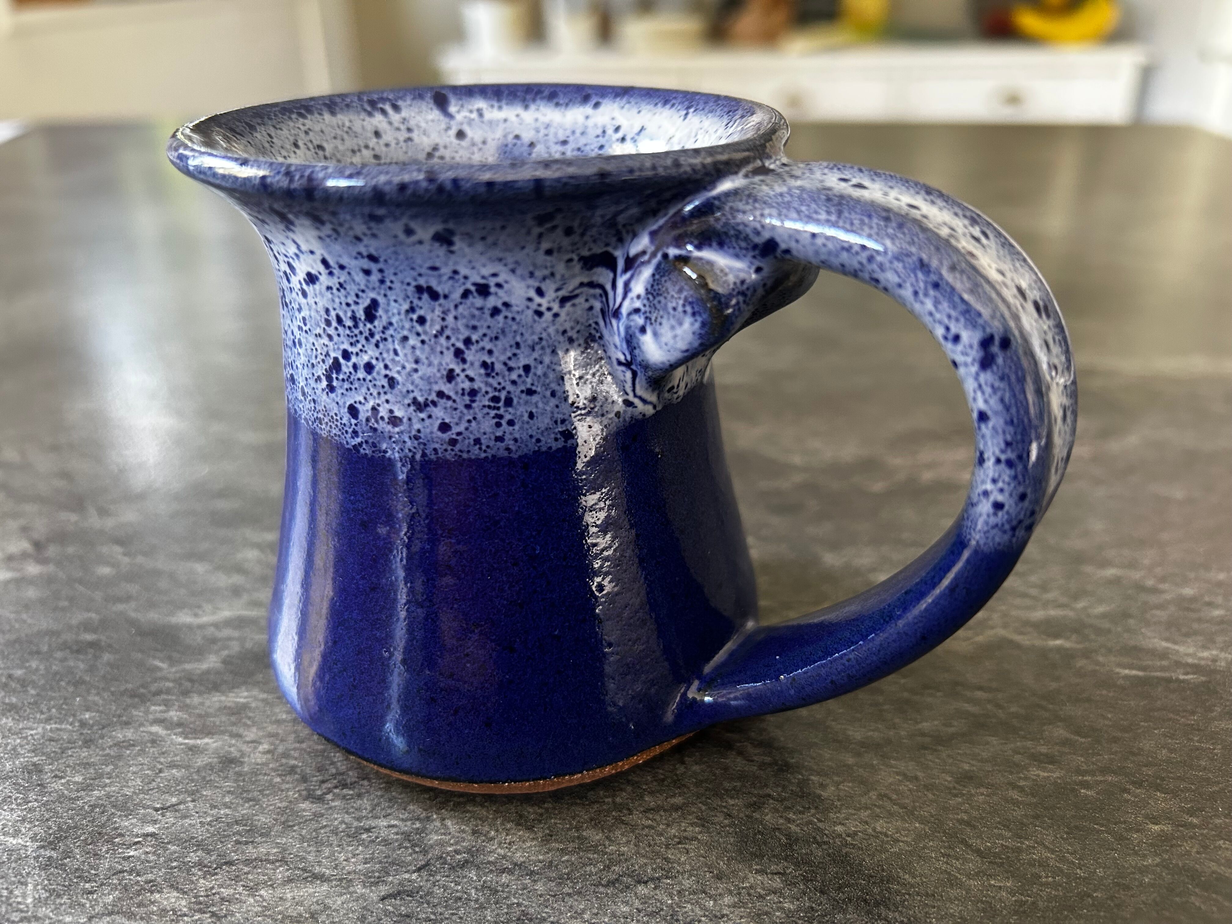 Small enamelled earthenware milk jug