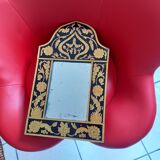 Mirror with black and gold screen-printed glass surround
