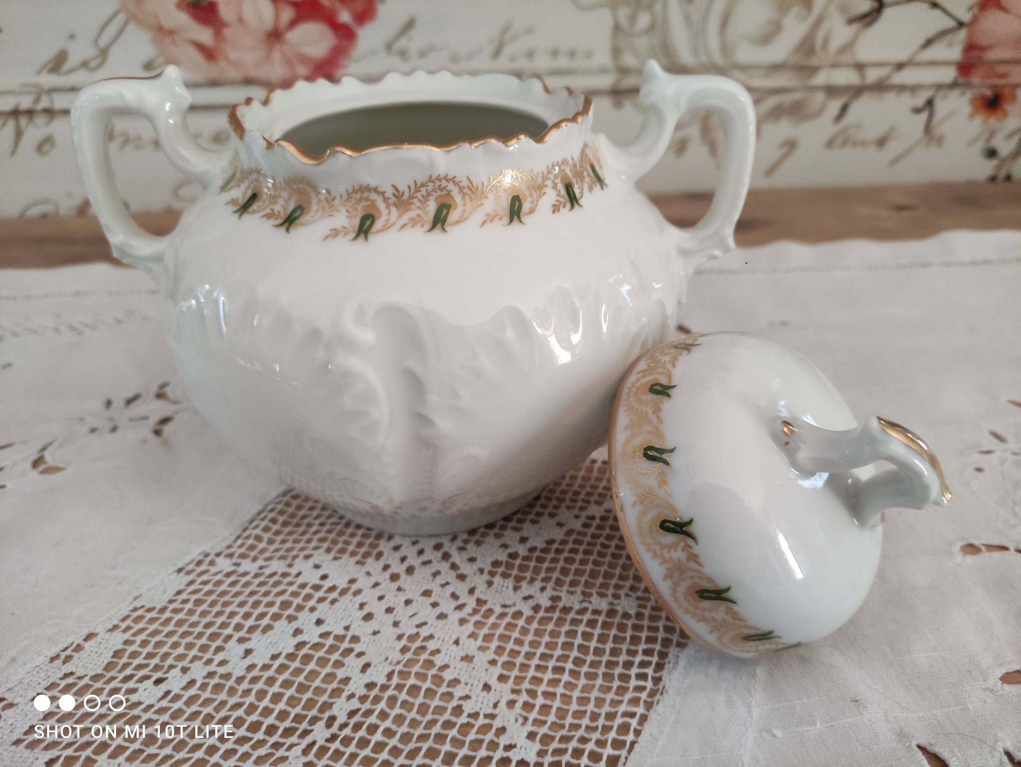 White porcelain sugar bowl decoration in relief and green and gold frieze