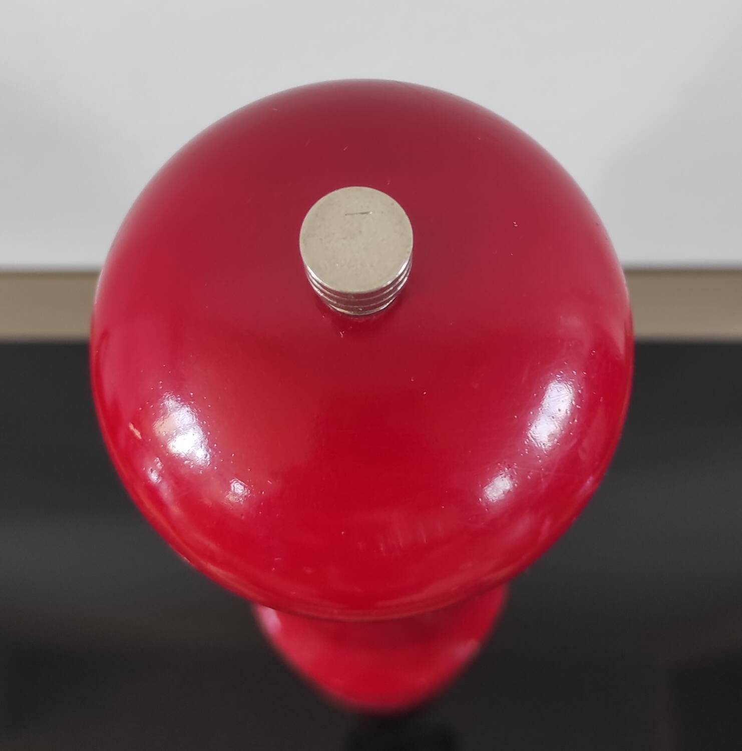 Giant vintage red lacquered wooden pepper mill