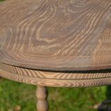 old small round oak table with can legs