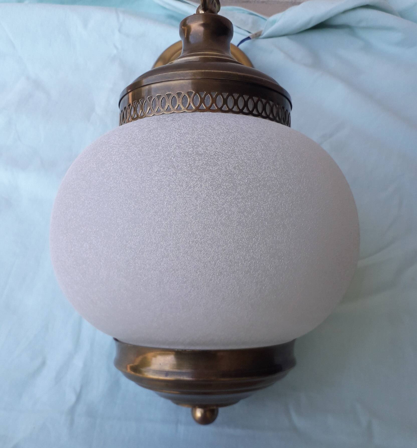 Glass and brass suspension