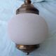 Glass and brass suspension