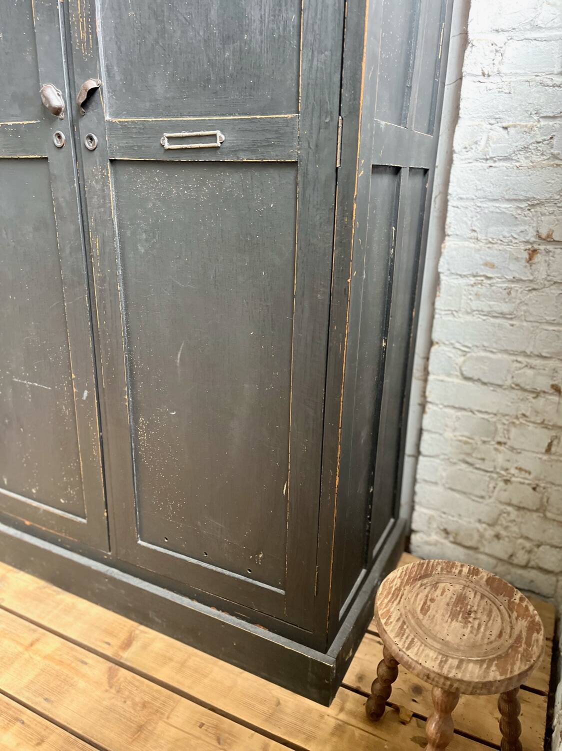 Old wooden locker with black patina