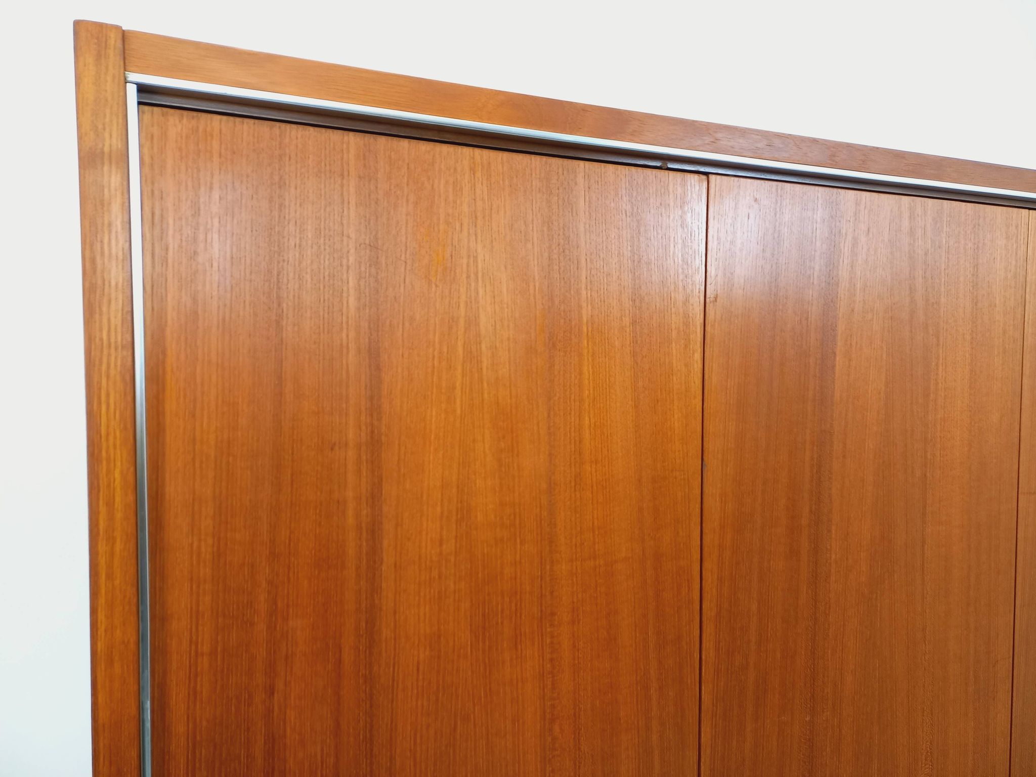 Vintage Scandinavian modernist wardrobe in teak and metal from the 1960s.