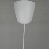 UFO-shaped pendant lamp with white glass on top and clear glass with white